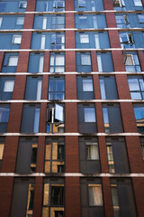 Fototapeta na wymiar brown building with symmetrical windows