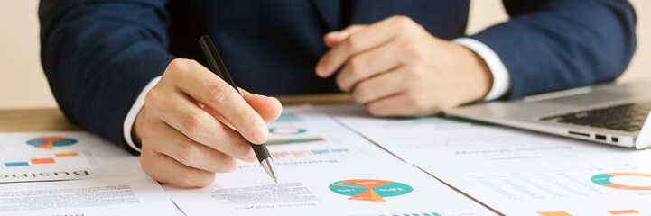 Businessmen and analysts conduct company financial audits, growth and investment chart analysis, business planning and strategies to maximize sales profits. Long-term action plans.