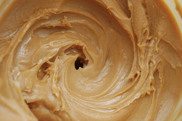top view of peanut butter in a container ,