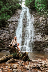 Travel. Girl travels through the mountains and waterfalls of wild nature. Unity, mental health, eco travel. Hiking in the mountains, van life vibes, travelling,good moments, digital detox