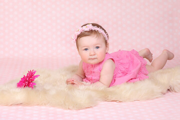 little girl against a pink background