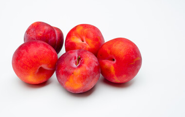 Fresh fruit plums isolated on a white background