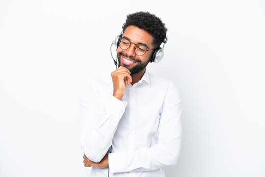 Telemarketer Brazilian Man Working With A Headset Isolated On White Background Looking To The Side