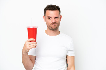 Young caucasian soda holding soda isolated on white background with sad expression