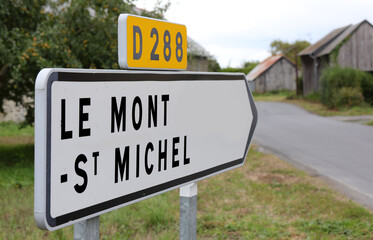 arrow with the inscription LE MONT ST MICHEL and the road D288 place where there is the island of...