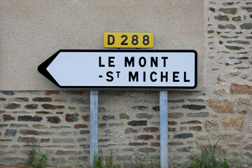 sign and arrow with the inscription LE MONT ST MICHEL place where the island of the famous abbey in Normandy