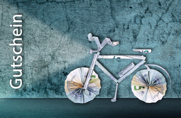 Electric bicycle made from banknotes for voucher