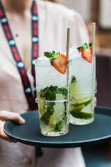 iced alcohol drink with mint and strawberry