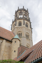 Fototapeta na wymiar Münster September 2021: The Gothic Liebfrauen-Überwasserkirche in the west of the city center dates from the 11th century.