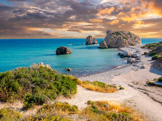 Cyprus sunset. Rocks of Aphrodite. Bay of Petra-Tu-Romiou. Beach next to village of Kuklia. Tour to...