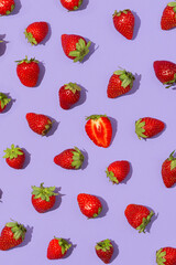 Fresh red strawberry isolated on purple background, top view. Strawberry seamless pattern