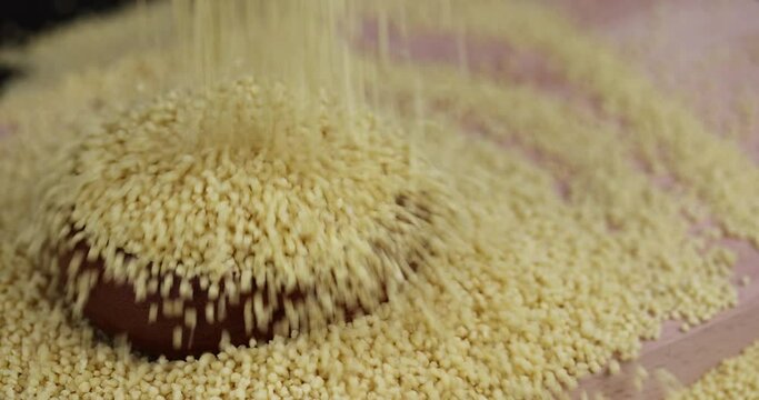 Sprinkle porridge couscous from wheat or millet, cooking dishes from traditional grits of crushed yellow couscous