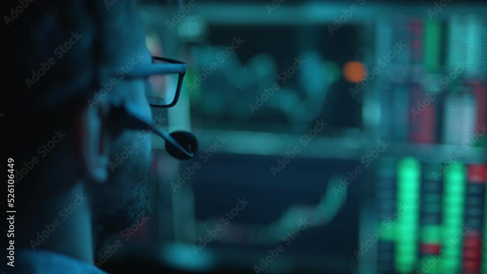 Poster trader is working with multiple computer screens with charts and data analysis and stock broker trad