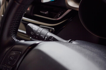 Fototapeta na wymiar car windshield rain wiper control switch close up