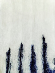 macro texture of blue paint on white fabric