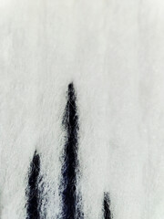 macro texture of blue paint on white fabric