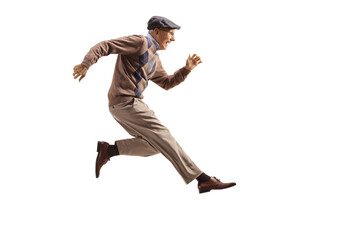 Excited elderly man jumping and kicking