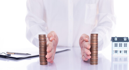 Hand separate saving money, finance, loan, debt into two stack coin. Dollar investment law increase...
