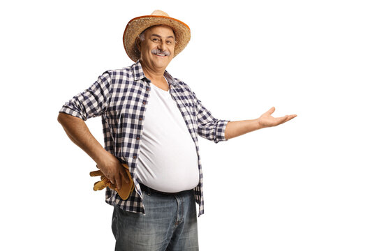 Smiling mature farmer holding something imaginary with hand