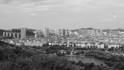 Obraz premium Jilin, Jilin, China - July 15 2021: The city of Jilin skyline in summer. Black and white.