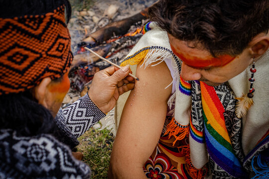 Sao Paulo, SP, Brazil - June 26 2022: Man applying Kambo frog poison medicine details.