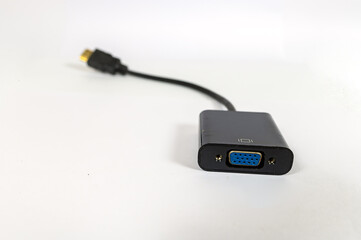 HDMI Convert VGA isolated on the white table, Display connector, Focus in front.