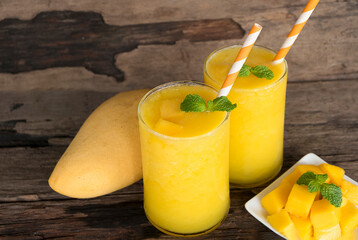 Mango juice fruit smoothies yogurt drink yellow healthy delicious taste in a glass slush for weight...