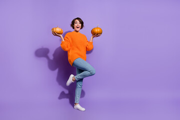 Fototapeta na wymiar Full body photo of young cheerful girl good mood pick pumpkin store isolated over purple color background