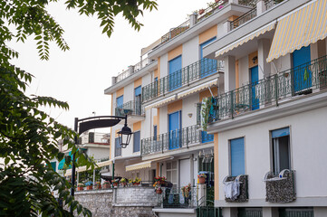 Fototapeta na wymiar Traditional Italian balconies in houses in the south