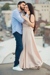 Naklejka premium Smiling, loving, beautiful people spend time together outdoors. couple in love outdoors.Concept of love, people, happiness and lifestyle.