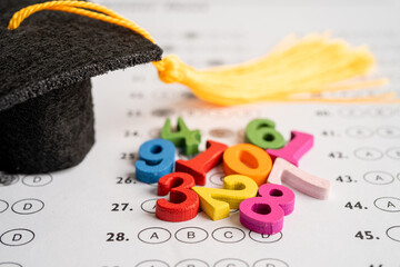 Math Number colorful  with graduation hat and pencil on Answer sheet background, Education study...