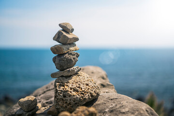 stone towers piled up on beach rocks