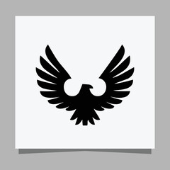 Vector illustration of a black eagle on white paper which is perfect for logos, business cards, emblems and icons