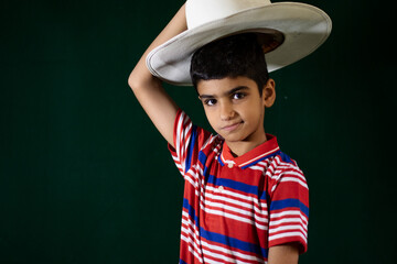 portrait of an Asian boy wearing cowboy hat