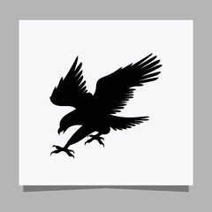 Vector illustration of a black eagle on white paper which is perfect for logos, business cards, emblems and icons