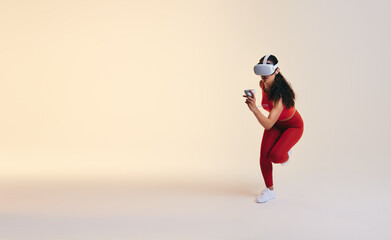 Fototapeta na wymiar Fit young woman working out in virtual reality