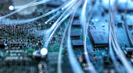 Fibre optics carrying data passing through computer circuit boards.