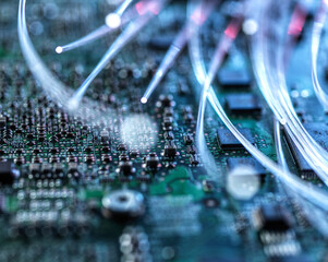 Fibre optics carrying data passing through computer circuit boards.