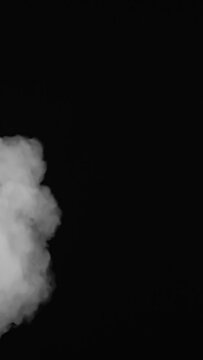 white smoke swirls on a black background vertical mobile video
