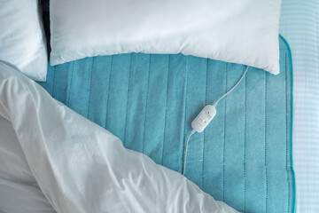 Bed with electric heating pad, top view