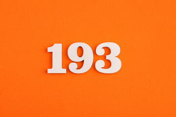 White wooden number 193 on eva rubber orange background