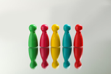 Colorful pawns on white background. Social inclusion concept