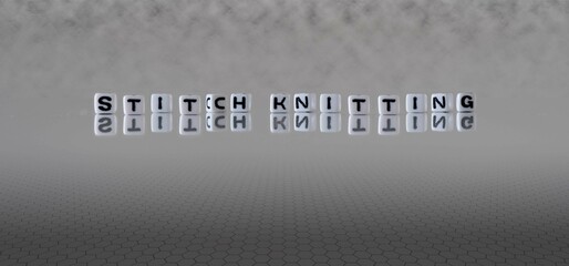 stitch knitting word or concept represented by black and white letter cubes on a grey horizon...