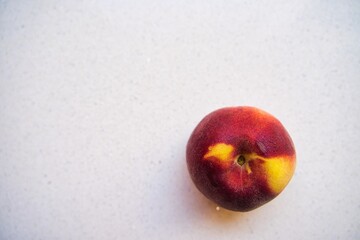 peach on white background. world food day.