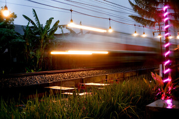 Abstract defocused motion blurred train moving at night. Locomotive train moving in motion blur
