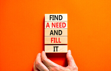 Find a need and fill it symbol. Concept words Find a need and fill it on wooden blocks on a beautiful orange background. Businessman hand. Business and find a need and fill it concept. Copy space.