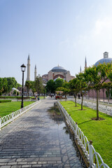 Fototapeta na wymiar Hagia Sophia Mosque in Istanbul, with the reflection in a puddle of rain, on a sunny day.