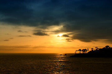 Fototapeta na wymiar Sunset over Twin Points in Laguna Beach.