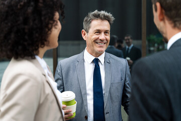 Business people meeting in a business park - Portrait of mature handsome businessman with elegant...