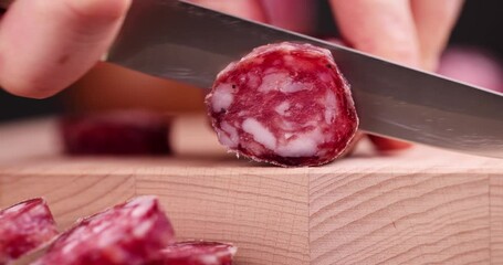 Cut the finished sausage into pieces on a cutting board, sausage product cut into pieces during cooking